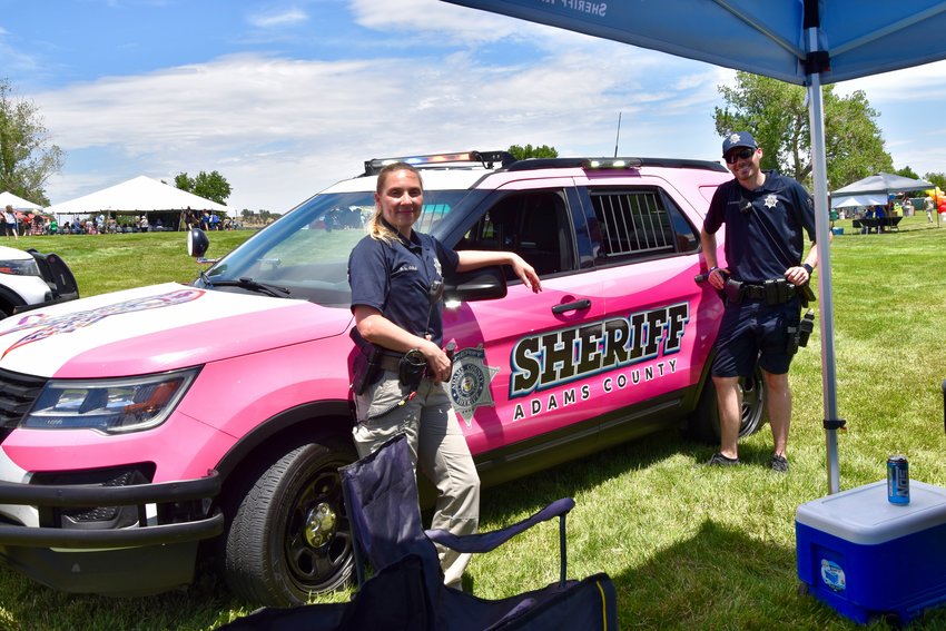 Adams County Sheriff Department Deputy Sherri Cole and Deputy Clayton Gardner with their pink cruiser to serve and protect.